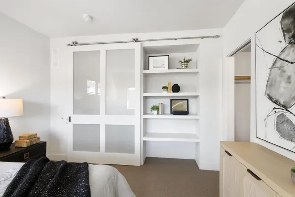 a bathroom with a toilet a sink and shower