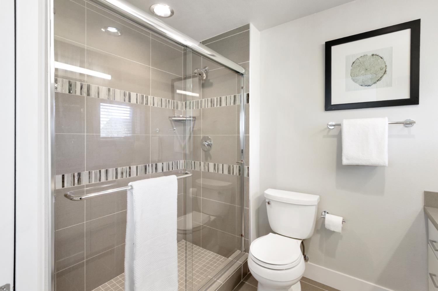 2746 5th Street Davis, CA 95618 - Photo 34 of 61 a bathroom with a toilet a sink and shower