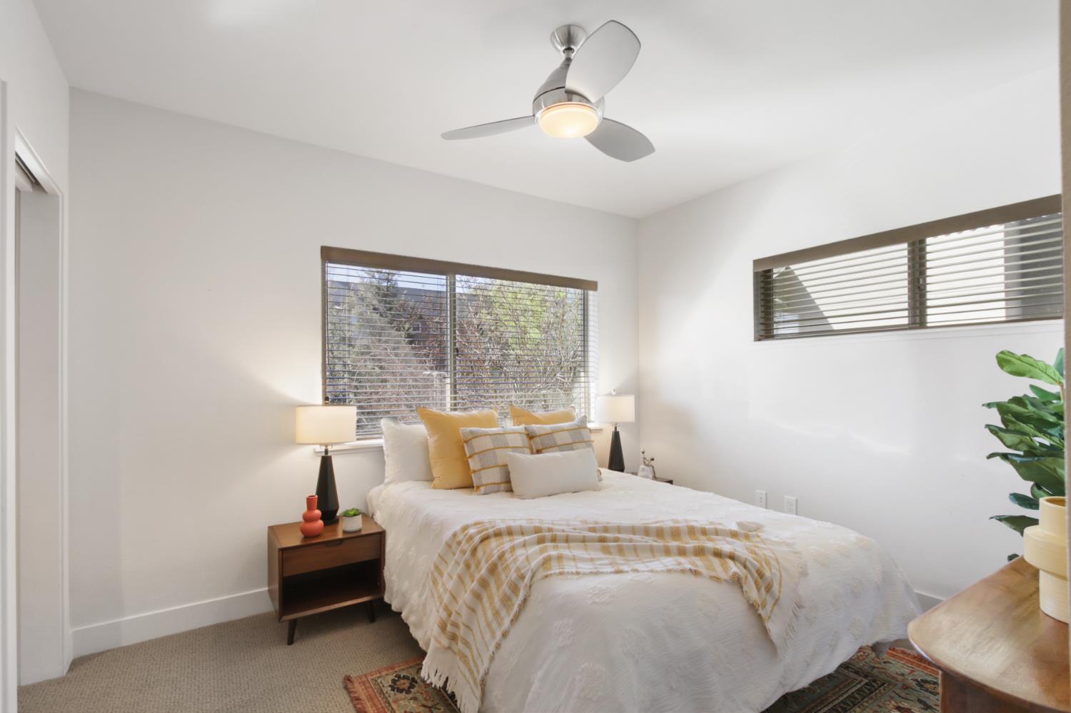 2746 5th Street Davis, CA 95618 - Photo 35 of 61 a bedroom with a large bed and a chandelier