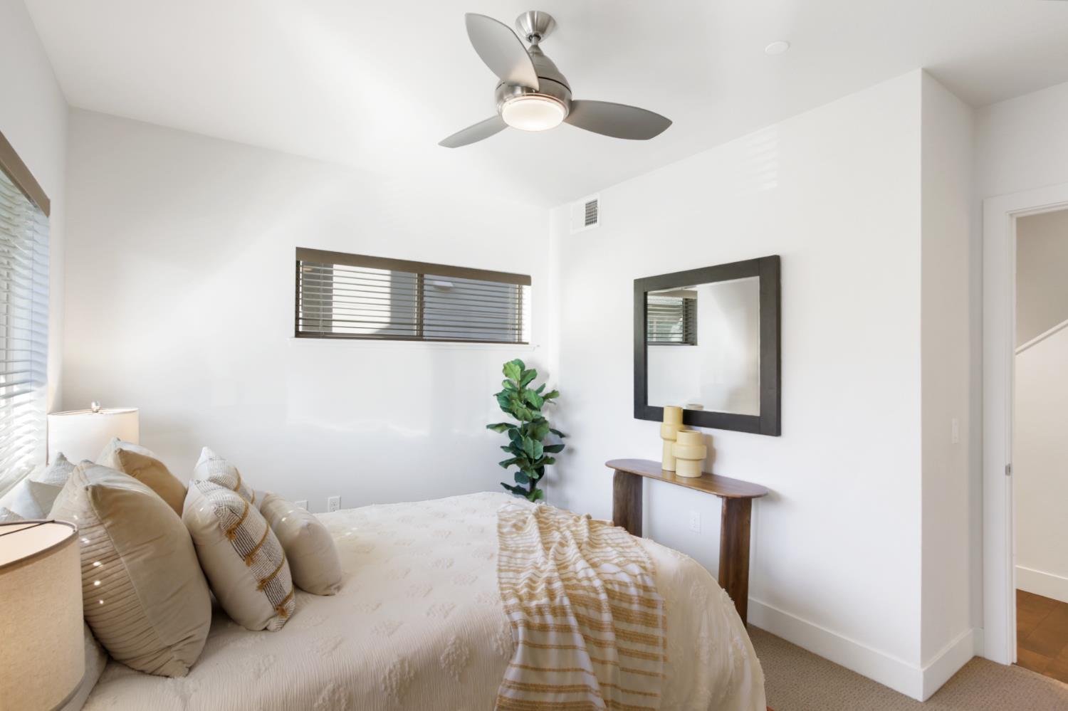 2746 5th Street Davis, CA 95618 - Photo 36 of 61 a bedroom with a bed and a chandelier