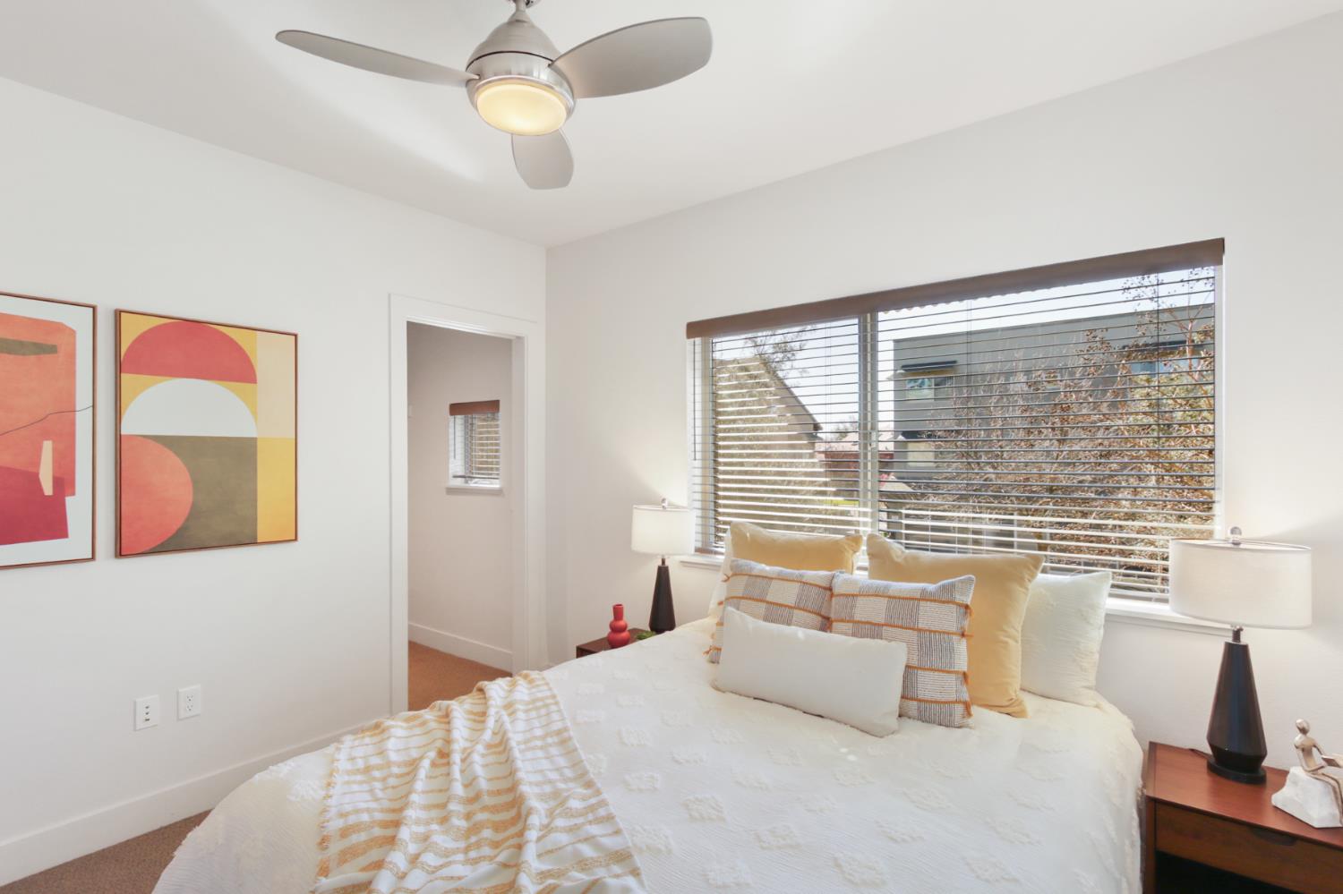 2746 5th Street Davis, CA 95618 - Photo 37 of 61 a bedroom with a large bed and a window