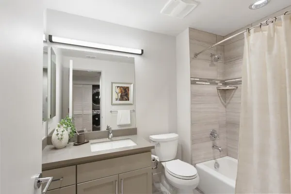 a kitchen with a refrigerator and a sink