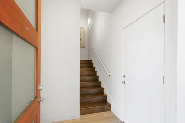 a view of entryway with wooden floor