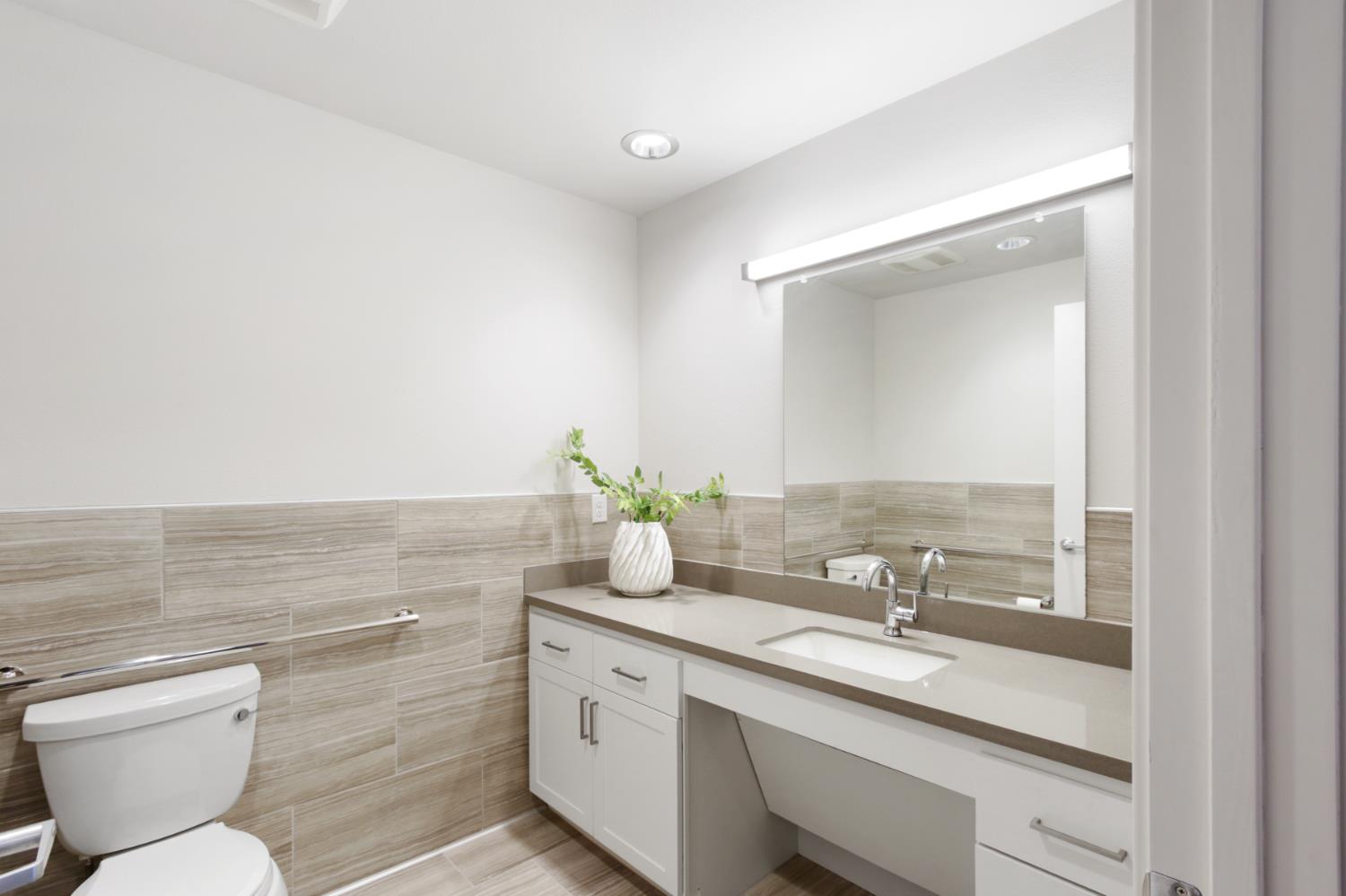 2746 5th Street Davis, CA 95618 - Photo 41 of 61 a bathroom with a granite countertop sink mirror and toilet