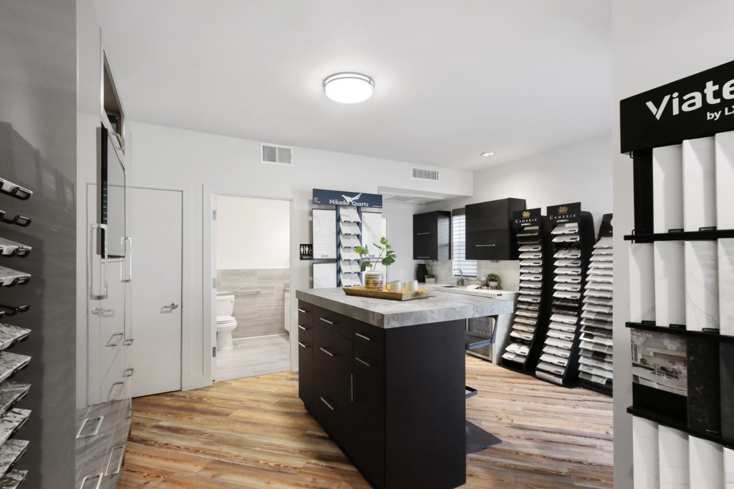 2746 5th Street Davis, CA 95618 - Photo 48 of 61 a kitchen with stainless steel appliances kitchen island granite countertop a table and chairs in it