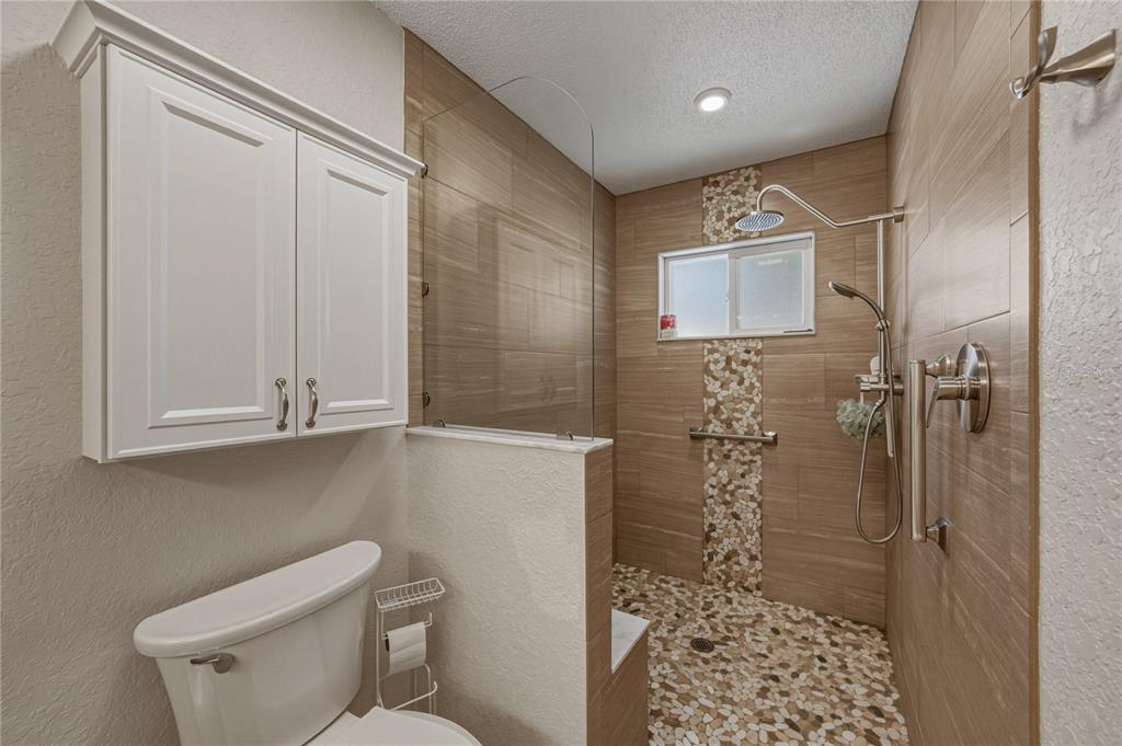7435 Kilbride Court Weeki Wachee, FL 34613 - Photo 42 of 67 a bathroom with a shower and a toilet