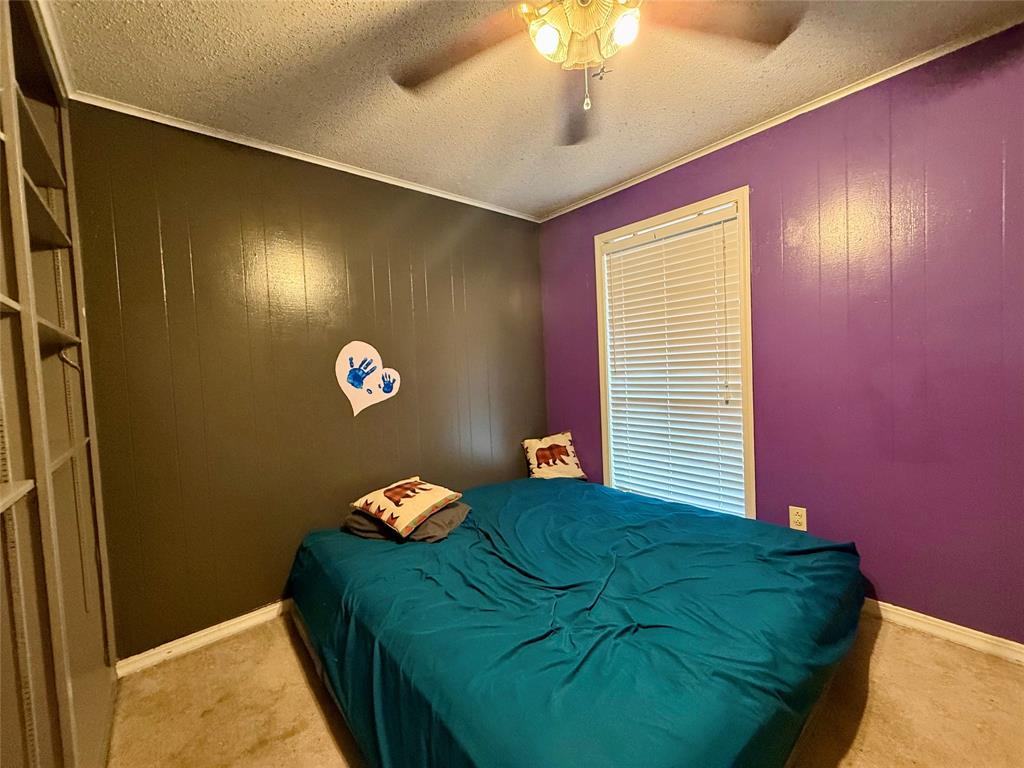 2104 Greenbriar Drive Ruston, LA 71270 - Photo 20 of 35 a bedroom with a bed and a chandelier