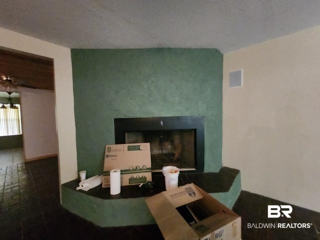 32749 Antietam Road Lillian, AL 36549 - Photo 23 of 47 Room details with a textured ceiling
