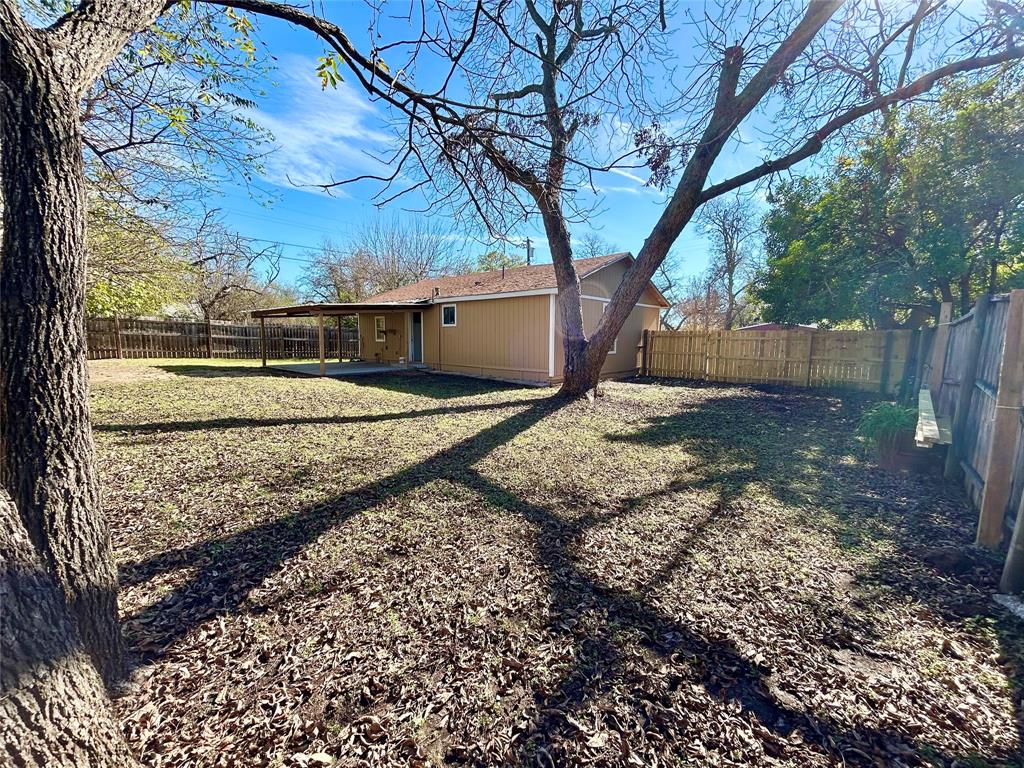 602 Ella Street Dublin, TX 76446 - Photo 12 of 13 a view of a yard with large trees