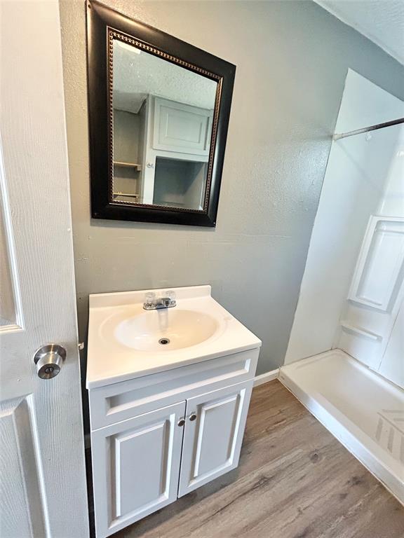 602 Ella Street Dublin, TX 76446 - Photo 3 of 13 a bathroom with a sink and a mirror