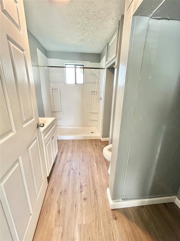 602 Ella Street Dublin, TX 76446 - Photo 5 of 13 a view of a room with wooden floor and staircase