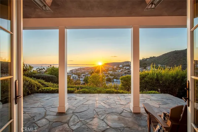 a view of a house with a yard and a garden