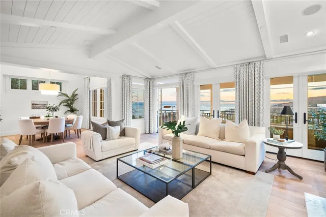 a kitchen with a sink a center island cabinets and stainless steel appliances