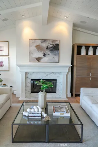 a dining room with furniture potted plants and wooden floor