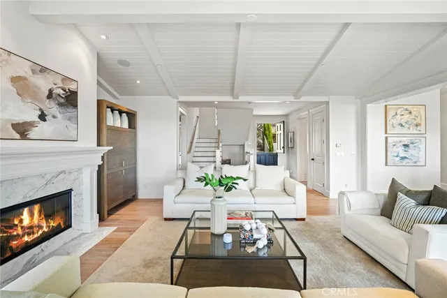 a bedroom with a large bed and windows