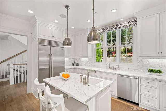 a view of a livingroom with furniture and a window