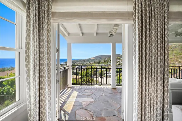 a balcony with furniture and garden view