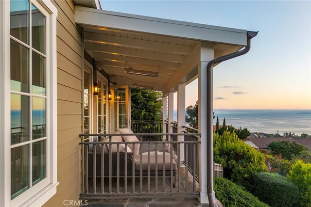 a view of a garden with plants and a bench
