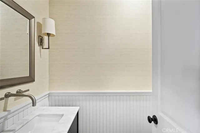 a view of a balcony with two chairs