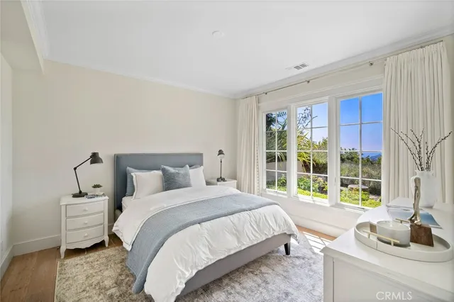 a view of a living room and kitchen with furniture
