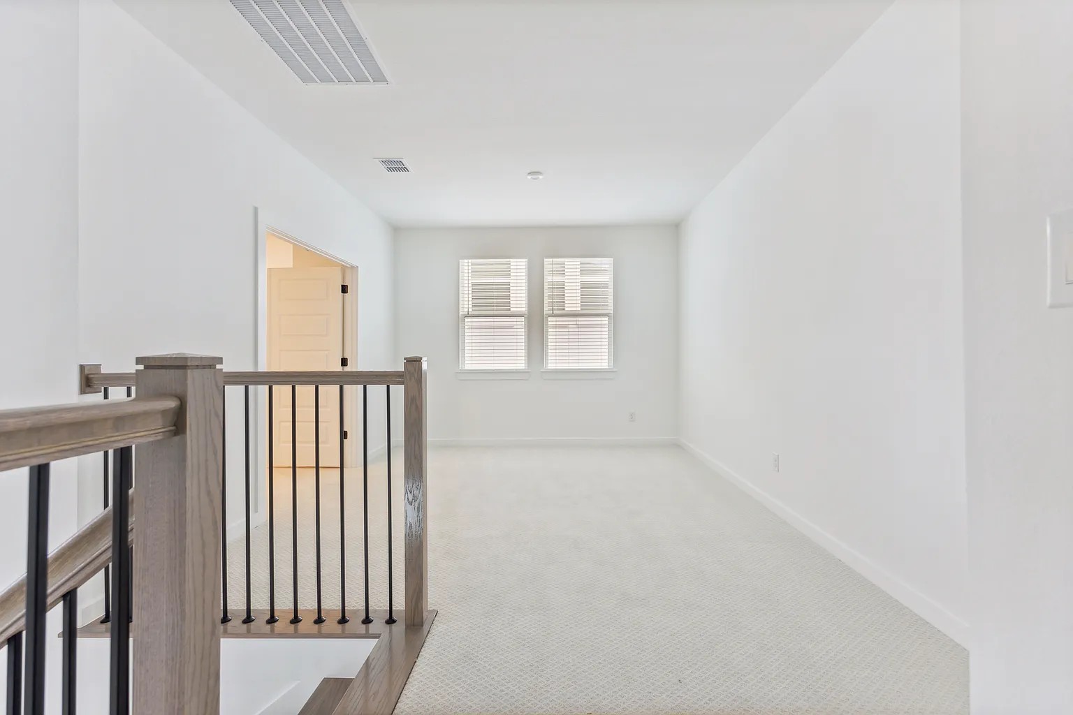 1909 Varese Path Leander, TX 78641 - Photo 26 of 40 A versatile upstairs loft with pristine carpet awaits your personal touch.