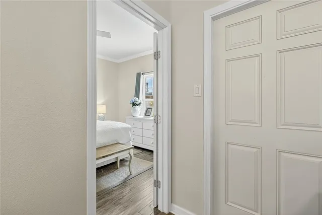 a room that has a bed and a view of bathroom