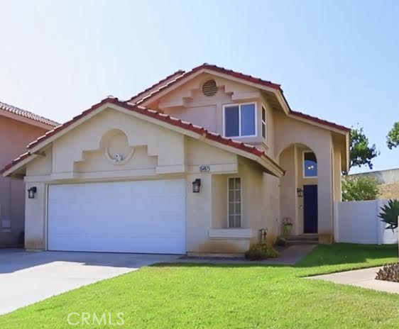 15497 Tobarra Road Fontana, CA 92337 - Photo 1 of 1 a front view of a house with a garden