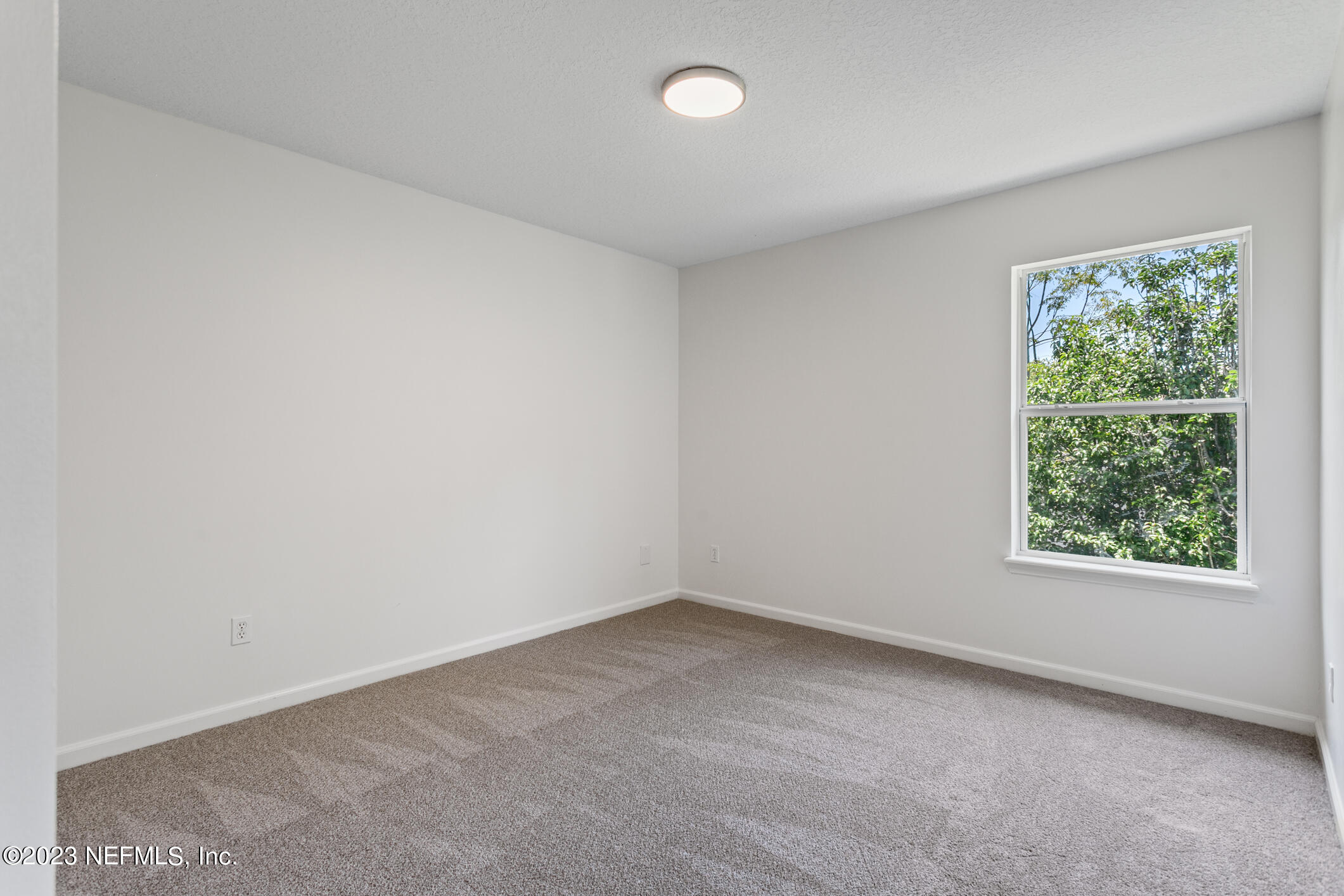 9188 Raptor Drive Jacksonville, FL 32221 - Photo 24 of 36 an empty room with a window