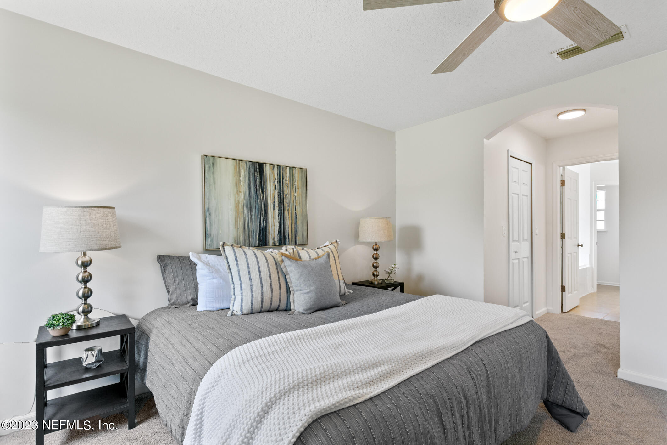9188 Raptor Drive Jacksonville, FL 32221 - Photo 28 of 36 a bedroom with a bed and a lamp