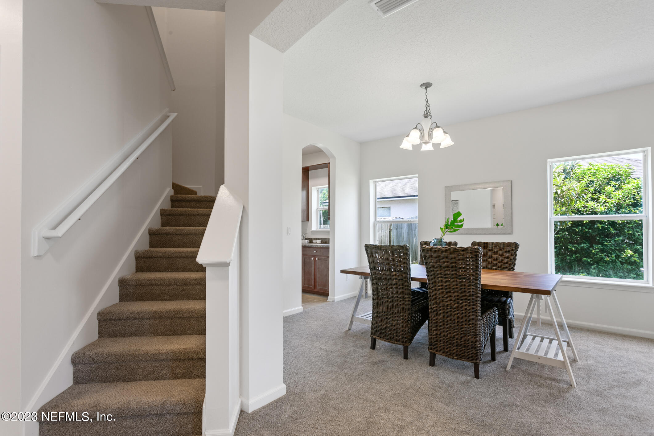 9188 Raptor Drive Jacksonville, FL 32221 - Photo 8 of 36 a view of a dining room with furniture and chandelier