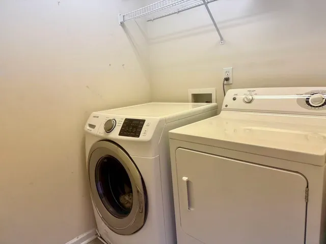 a utility room with dryer and washer
