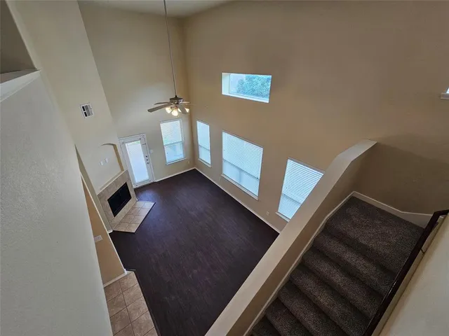 a view of an empty room and fire place