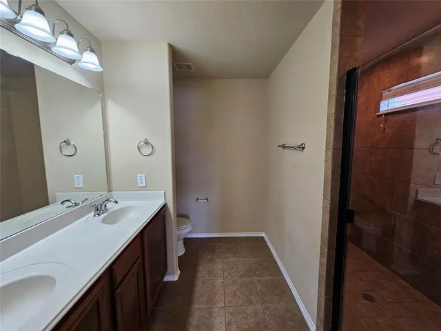 a bathroom with a sink a mirror and a shower