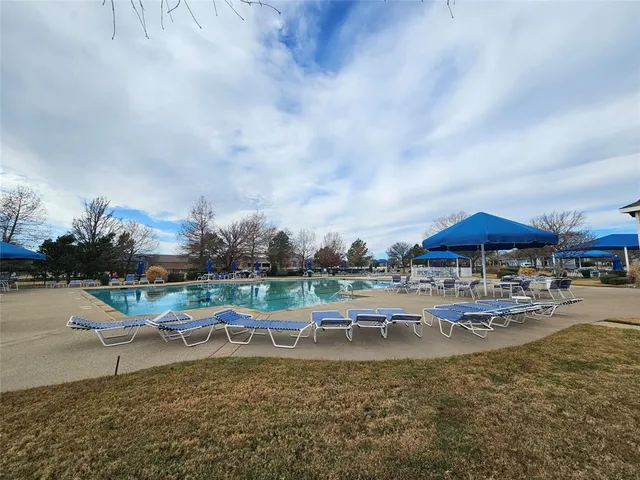 a view of a lake with outdoor seating