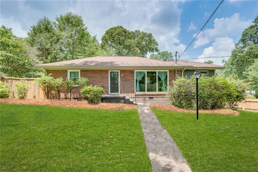 714 Valley Brook Road Decatur, GA 30033 - Photo 1 of 1 a view of a house with a yard and a garden