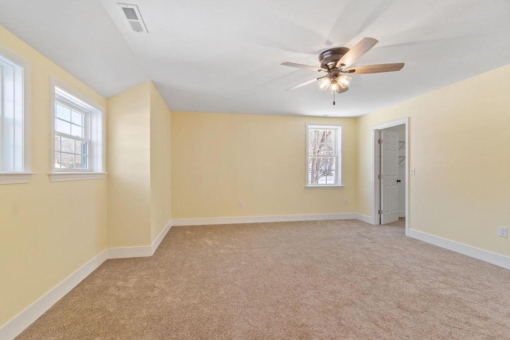 120 Townsend Street, Unit 1 Pepperell, MA 01463 - Photo 11 of 25 a view of an empty room with a window