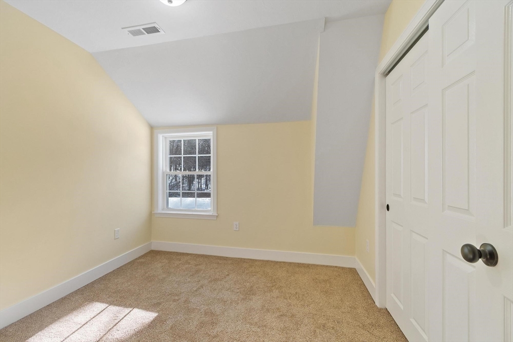 120 Townsend Street, Unit 1 Pepperell, MA 01463 - Photo 15 of 25 a view of a small space with wooden floor and a window