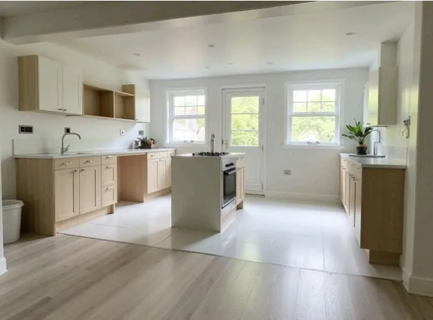 a view of a kitchen with cabinets and wooden floor