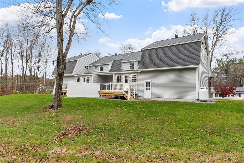 120 Townsend Street, Unit 1 Pepperell, MA 01463 - Photo 23 of 25 a house view with a garden space