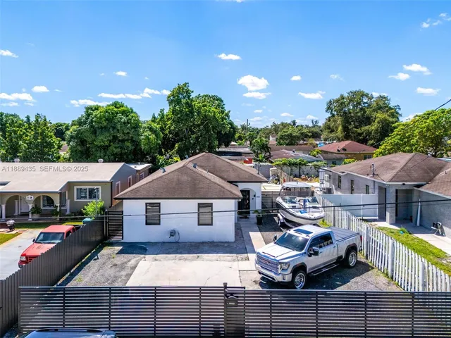 a aerial view of a house with swimming pool and deck