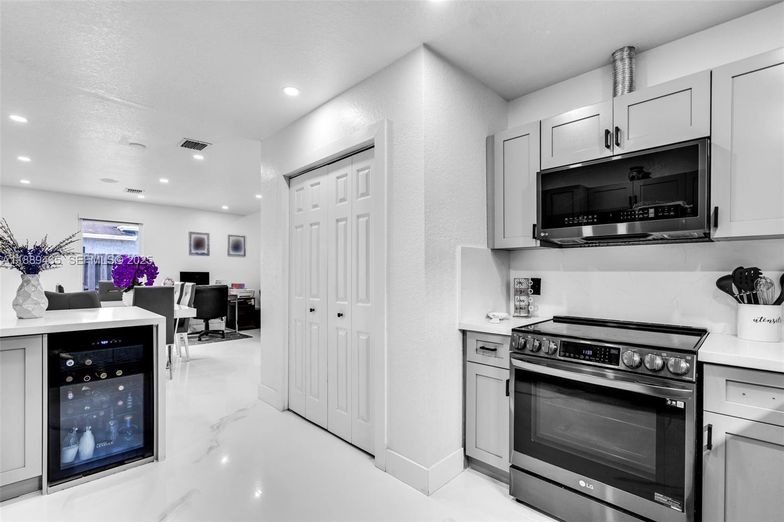 3022 Northwest 95th Street Miami, FL 33147 - Photo 14 of 47 a open kitchen with cabinets and stainless steel appliances