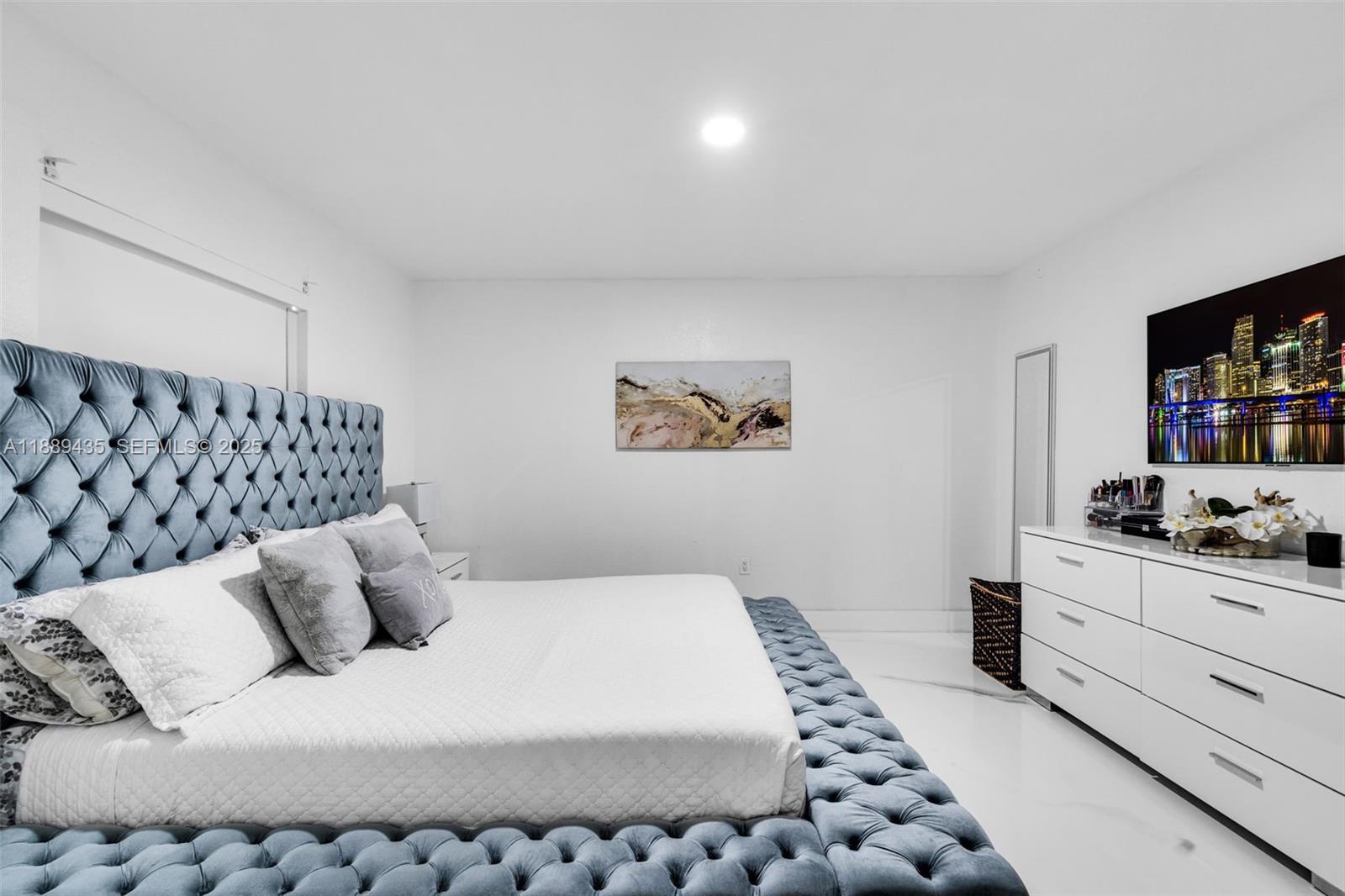 3022 Northwest 95th Street Miami, FL 33147 - Photo 17 of 47 a bedroom with a bed and dresser