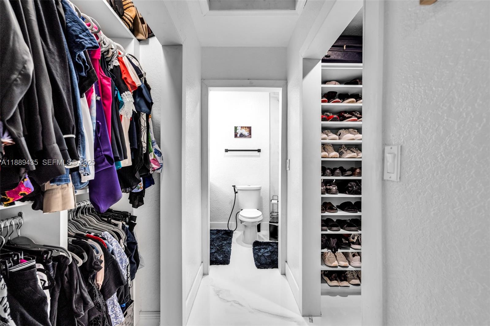 3022 Northwest 95th Street Miami, FL 33147 - Photo 20 of 47 a view of walk in closet with clothes and shoes