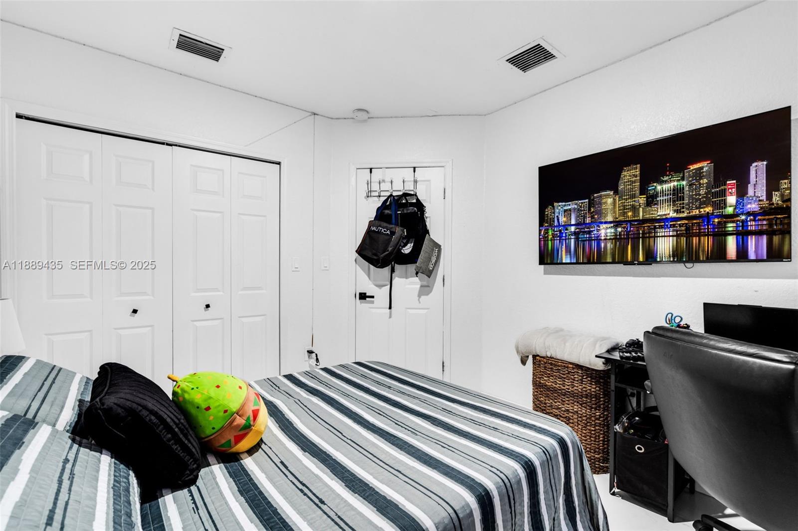 3022 Northwest 95th Street Miami, FL 33147 - Photo 23 of 47 a bedroom with a bed and a walk in closet