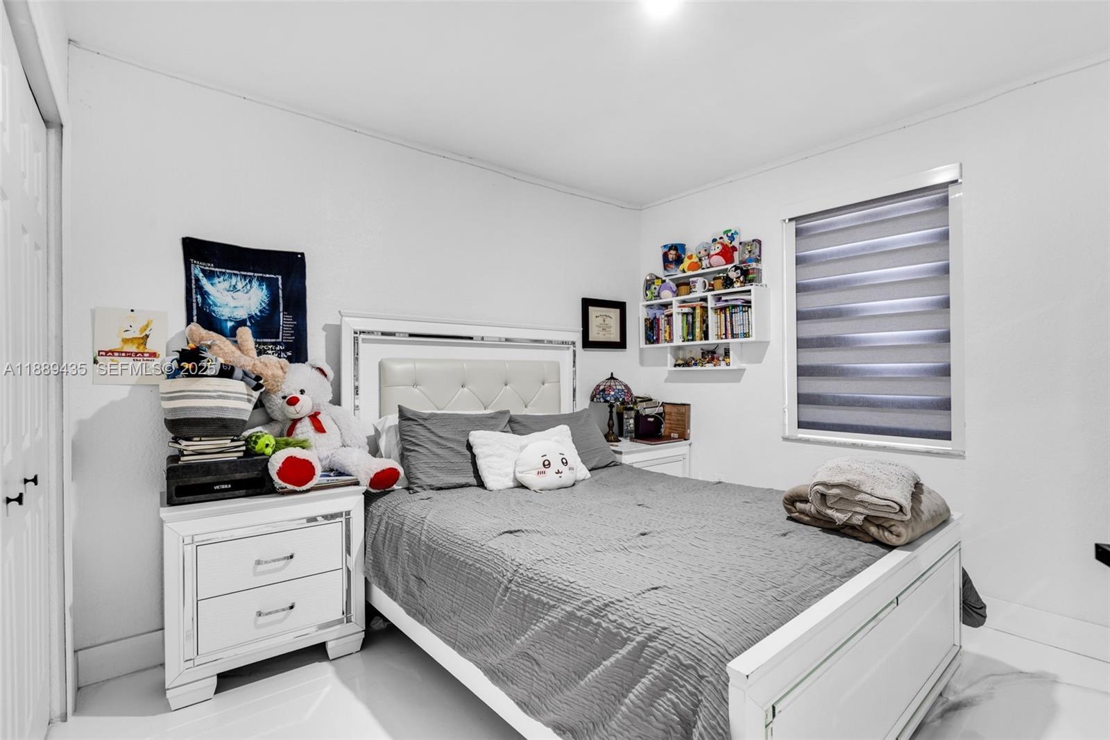 3022 Northwest 95th Street Miami, FL 33147 - Photo 25 of 47 a bedroom with a bed and cabinets