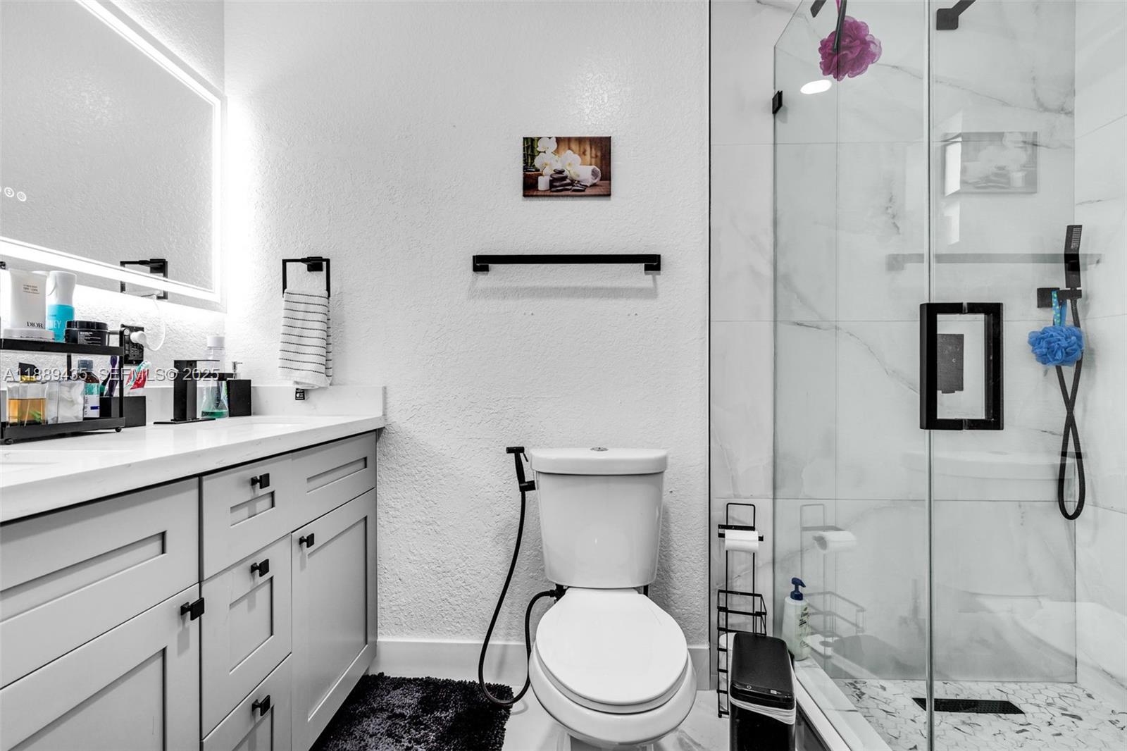 3022 Northwest 95th Street Miami, FL 33147 - Photo 28 of 47 a bathroom with a toilet sink and shower