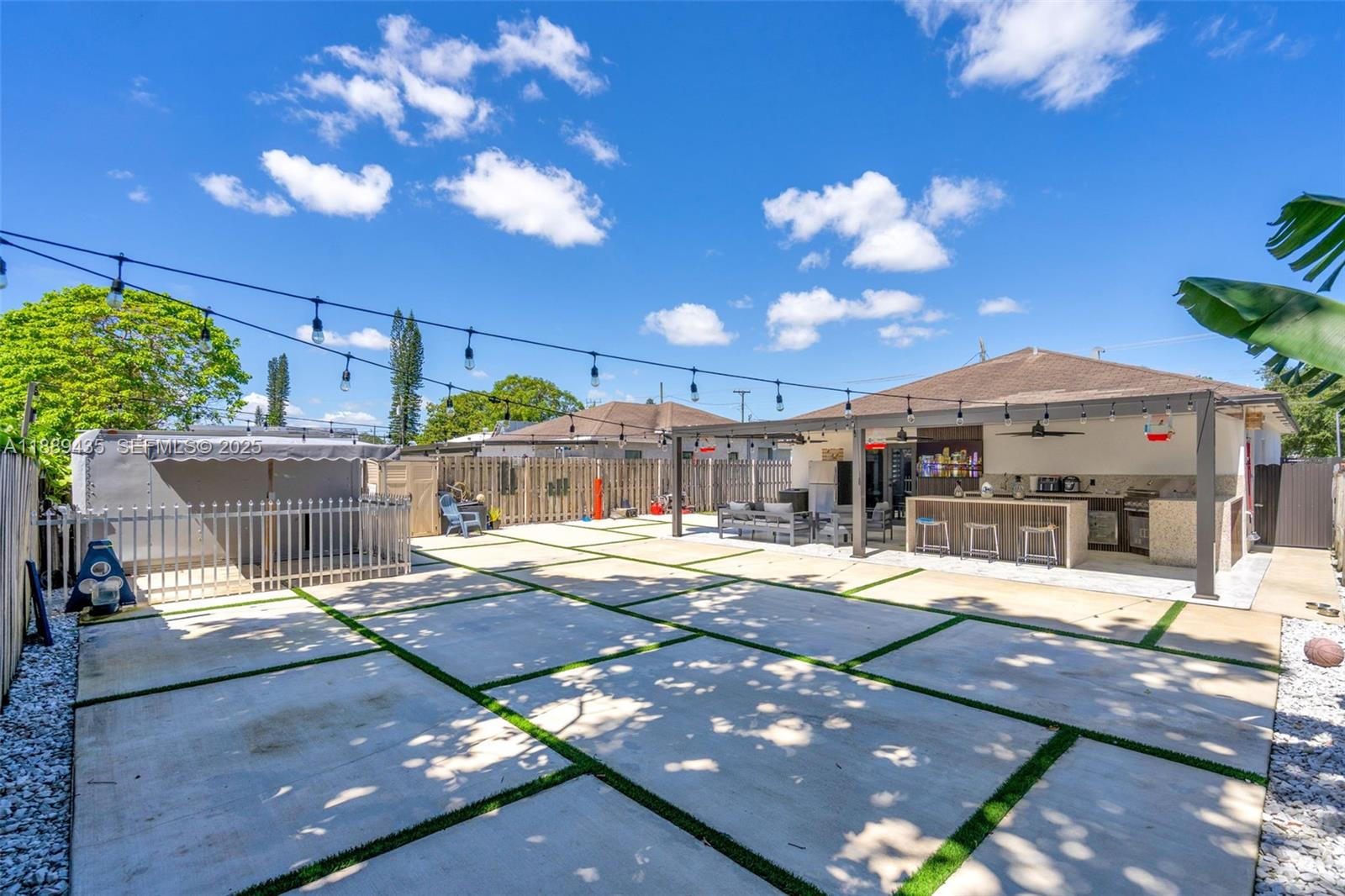 3022 Northwest 95th Street Miami, FL 33147 - Photo 30 of 47 a view of a patio with a table and chairs