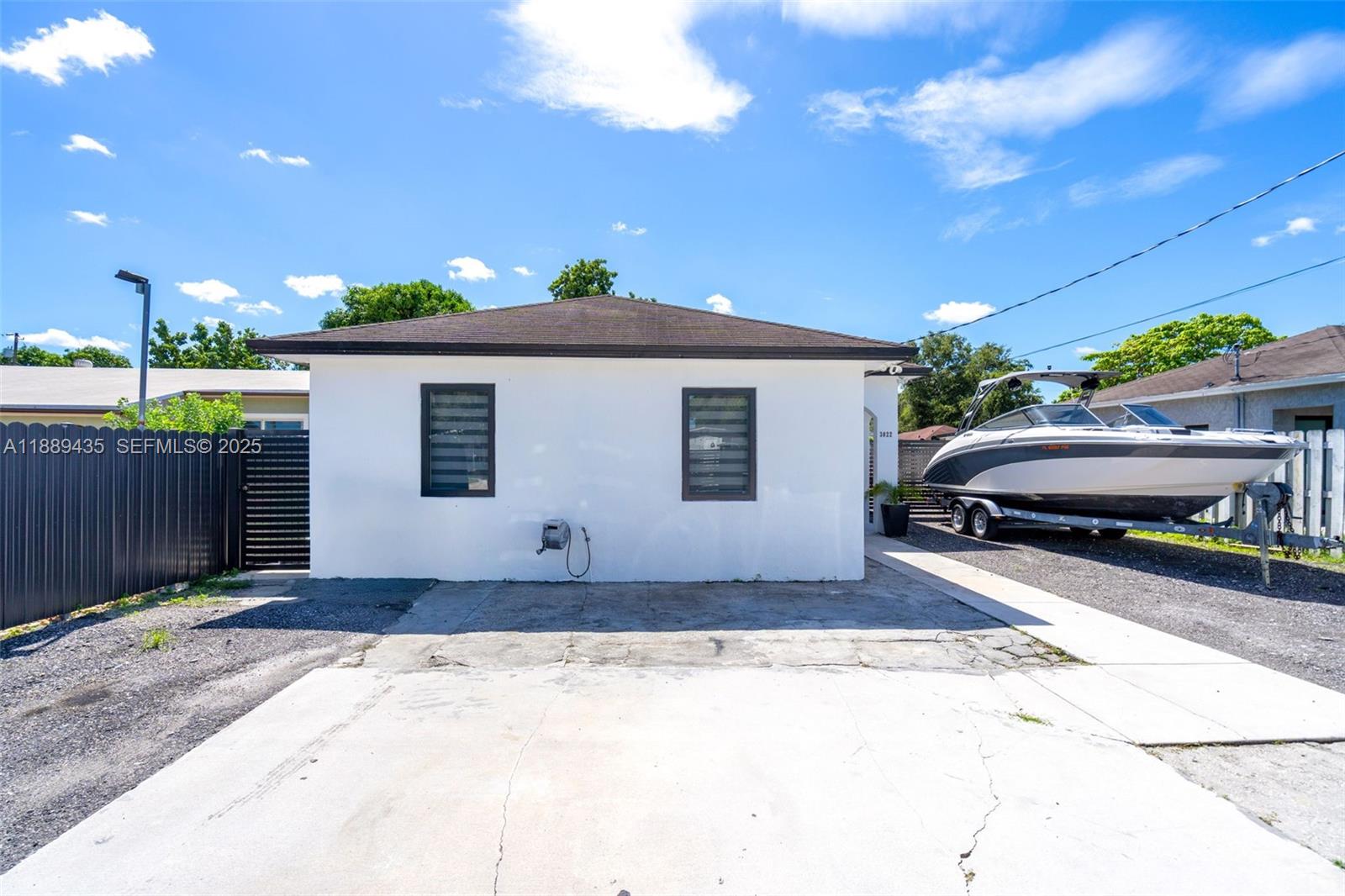 3022 Northwest 95th Street Miami, FL 33147 - Photo 3 of 47 a front view of a house with a yard