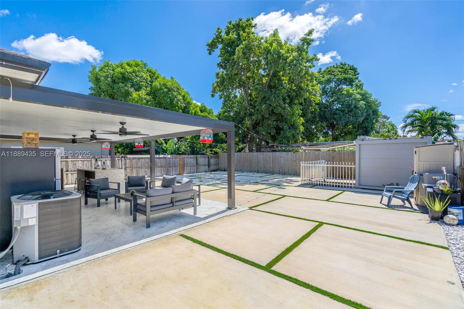 3022 Northwest 95th Street Miami, FL 33147 - Photo 31 of 47 a view of a backyard with a sitting area and furniture