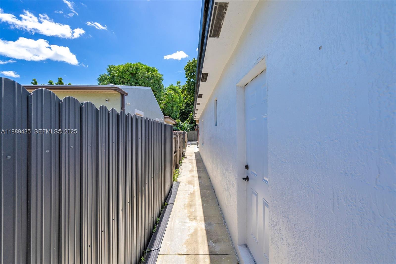 3022 Northwest 95th Street Miami, FL 33147 - Photo 36 of 47 a view of a house with a backyard
